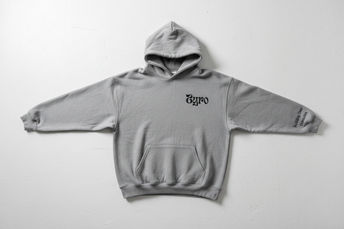 Grey ZYRO Hoodie from above on white cement floor